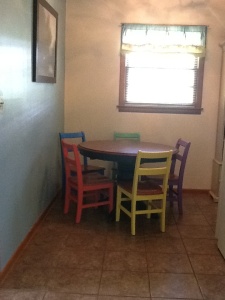 Walking in from the carport we still have that itty bitty dining area. Just a new table and chairs. New tile flooring.