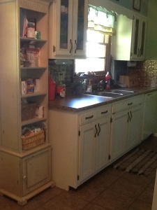 Same old cabinets, but we used Kitchen Tune-up to "tune them up." New countertops from Lowes.